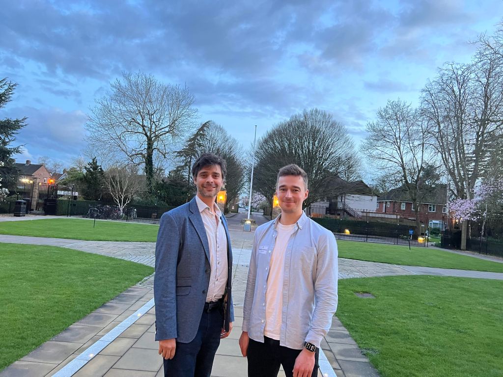 Two men standing in a park with houses and trees behind them. Matias Acosta with co-founder Dr Sebastian Horstmann from Cosysense.